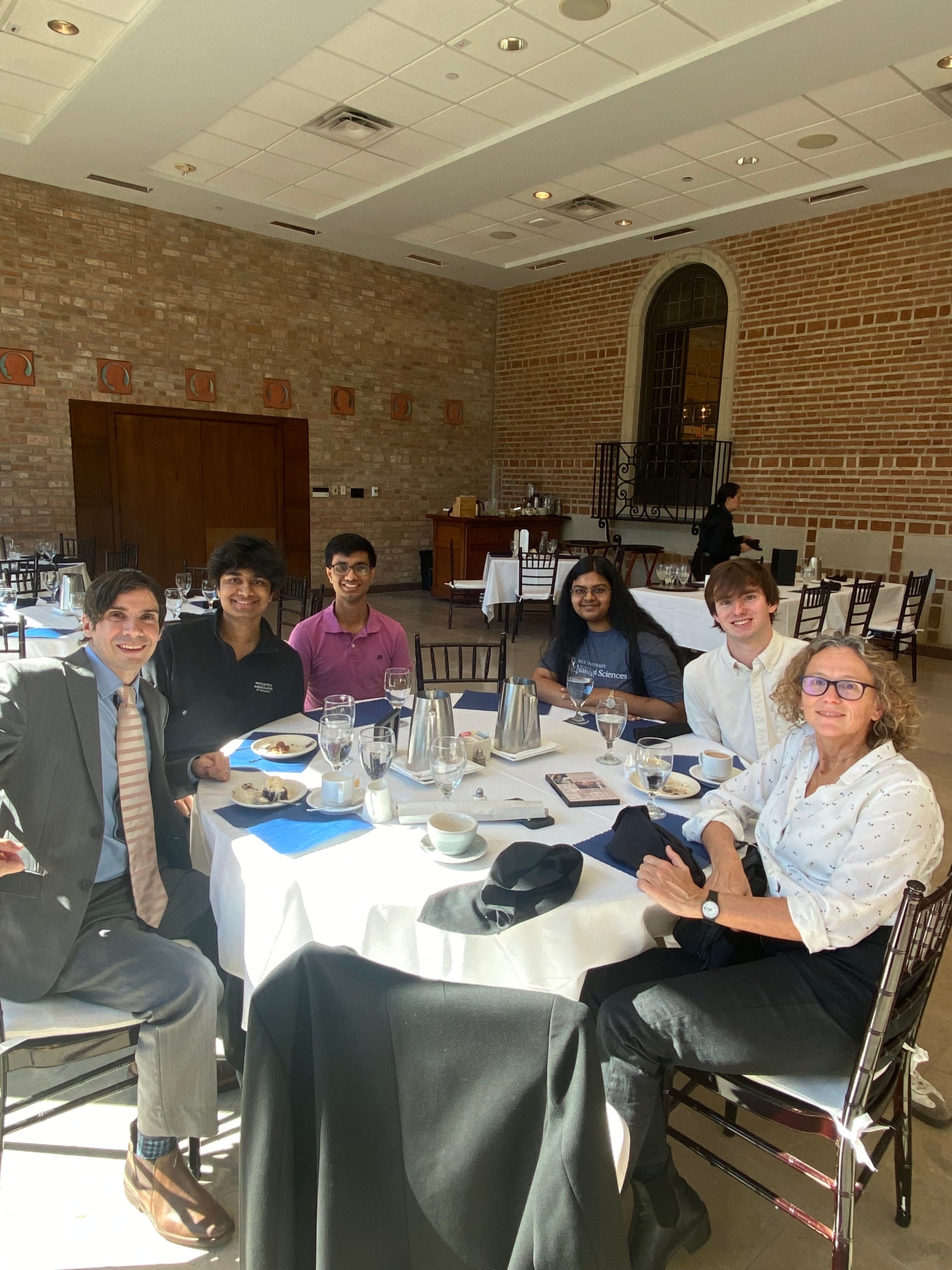 Rice University students join Ms. Solomonoff at Cohen House.